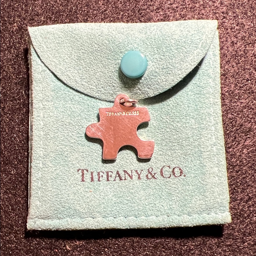 Rare Tiffany & Co. 925 Sterling Silver Puzzle Piece Charm.